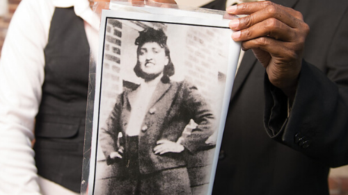 Children of Henrietta Lacks showing a black and white photo to the camera