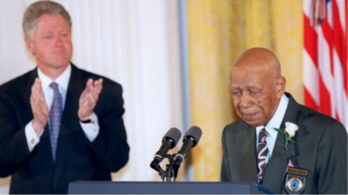 Herman Shaw speaks as President Bill Clinton looks on during ceremonies at the White House on May 16, 1997, during which Clinton apologized to the survivors and families of the victims of the Tuskegee Syphilis Study.